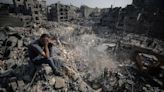 Airstrikes blast UN shelters, official says, as Israel announces complete encirclement of Gaza city