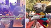 Concert goer captures precious moment elderly man holds his dog up to see