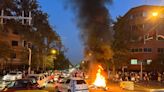 Iran riot police clash with students protesting young woman's death