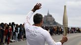 France’s Bastille Day parade meets the Olympic torch relay in an exceptional year