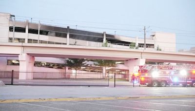 8 cars burned, 13 others damaged in Dallas parking garage fire, officials say