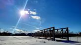 Massive bridge structure awaits final placement over Black River Canal