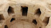 Catacomb-style building re-emerges from the sand to reveal ancient Egyptian coffins