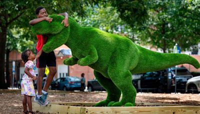 They’re big, green and made of grass. Downtown Raleigh dinosaurs aim to delight.