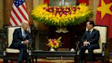 Biden highlights business deals and pays respects at John McCain memorial to wrap up Vietnam visit