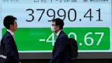 Stock market today: Asian benchmarks mostly slide as investors focus on earnings