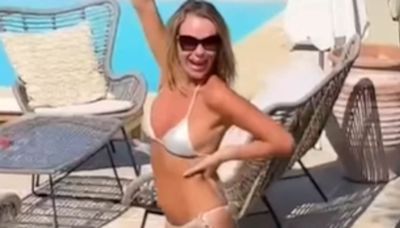 Amanda Holden, 53, strips down to a tiny silver bikini