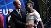 Prince William hugs England goal hero Bukayo Saka