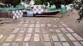 Photos show Colombian authorities unloading 5,800 pounds of cocaine from a submarine captured in the Pacific