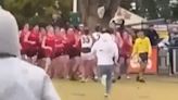 Shocking moment thugs storm pitch and throw punches