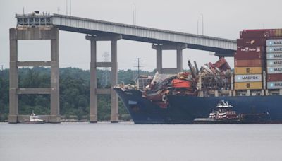 Tugboats remove cargo ship that toppled Francis Scott Key Bridge, assist vessel back to port