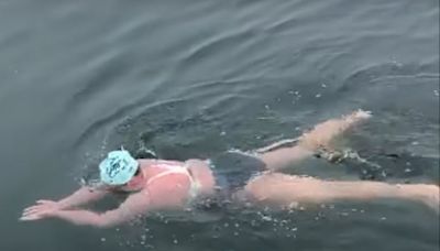 Grandmother makes history as first person to complete 17-hour swim through shark-infested waters