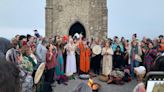 Hundreds watch solstice sunrise at Glastonbury Tor