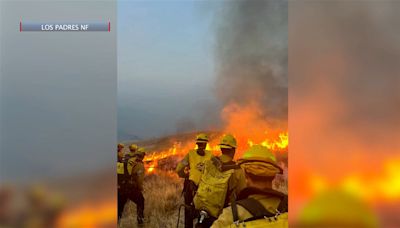 County Fire officials say rugged terrain, weather and finding smoldering remains and hotspots are the biggest challenges of containing the Lake Fire