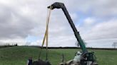 Firefighters race to rescue cows stuck in 4m slurry pit