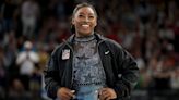 Simone Biles leads Team USA in qualifying, despite calf pain