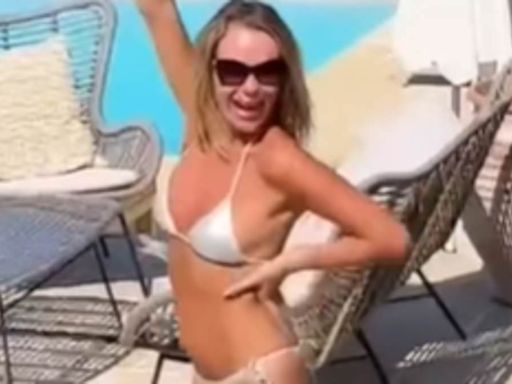 Amanda Holden, 53, strips down to a tiny silver bikini