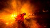 Firefighters gain ground against Southern California wildfire but face dry, windy weather