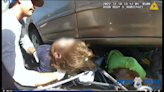 Harrowing video shows Florida cop and passersby free woman and child pinned under car