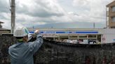 Holes poked in Mount Fuji barrier, Japan town says