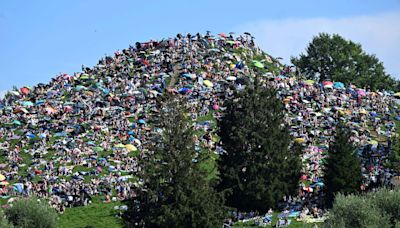 Fans swarm hill in Munich, claiming a high perch for watching Taylor Swift concert for free