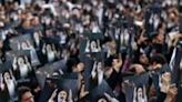Mourners holding photographs of the late president gather on Monday evening in Tehran's Valiasr Square
