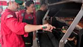 At the 'Super Bowl of Swine,' global barbecuing traditions are the wood-smoked flavor of the day