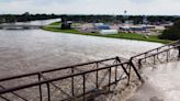 Wading Through Neck-high Waters in Iowa, a Husband Implored His Wife to Keep Going