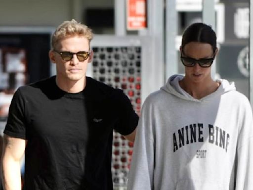 Cody Simpson gives Emma McKeon a playful pat on the bottom