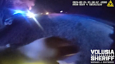 Deputy ‘clipped’ by passing van while aiding crash, Florida cops say. See close call