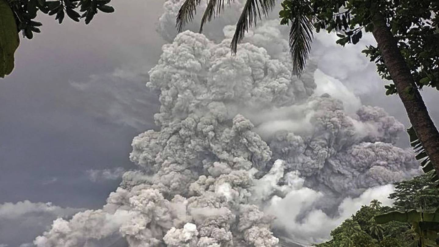 Indonesia's Mount Ruang erupts again, spewing ash and peppering villages with debris