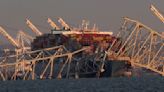 Baltimore Key Bridge collapse plunges vehicles into the water after container ship collision