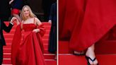 Jennifer Lawrence hit the Cannes red carpet in a Christian Dior gown and a black pair of flip-flops, adding to her impressive history of unlikely shoes