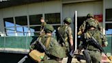 2 gunmen opened fire during a firearms training exercise and killed 11 Russian soldiers at a training base, say reports