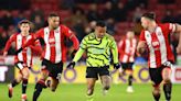 Arsenal hit Sheffield United for six to keep pace with leaders