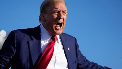 Donald Trump calls judge "crooked" during campaign stop in Michigan