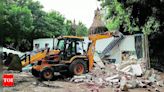 Surat police bulldoze illegal properties of notorious gangster Hashim Siddiqi | Surat News - Times of India