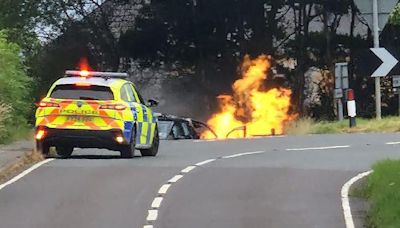 Road closed after vehicle hits gas terminal