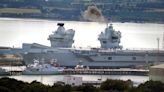 HMS Prince of Wales leaves dry dock after nine months of repairs