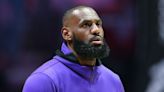 LeBron James, Lakers beat Suns after controversial call, clinch tourney spot