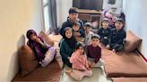 'We're stuck in a mouldy flat with our 11 children and one toilet'