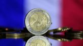 French shares drop, bond risk premium rises after election result