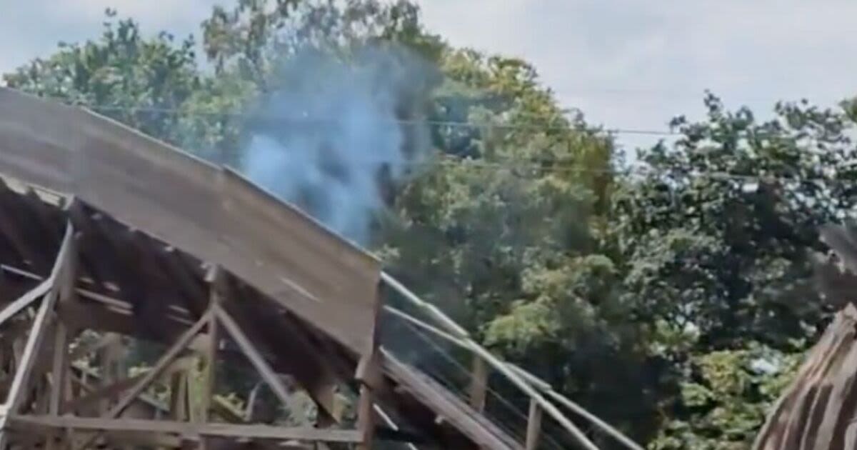 Chaos at major UK theme park with ride evacuated as smoke rises into the sky