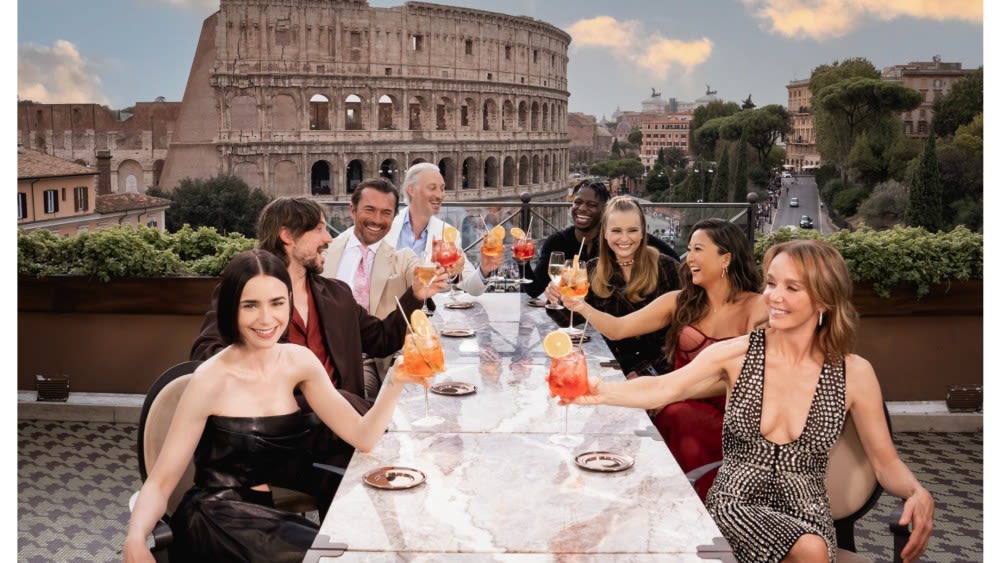 ‘Emily in Paris’ Season Four Part Two Launches in Rome With Cast Posing by the Colosseum and a Fleet of Vintage Fiat 500 Cars...