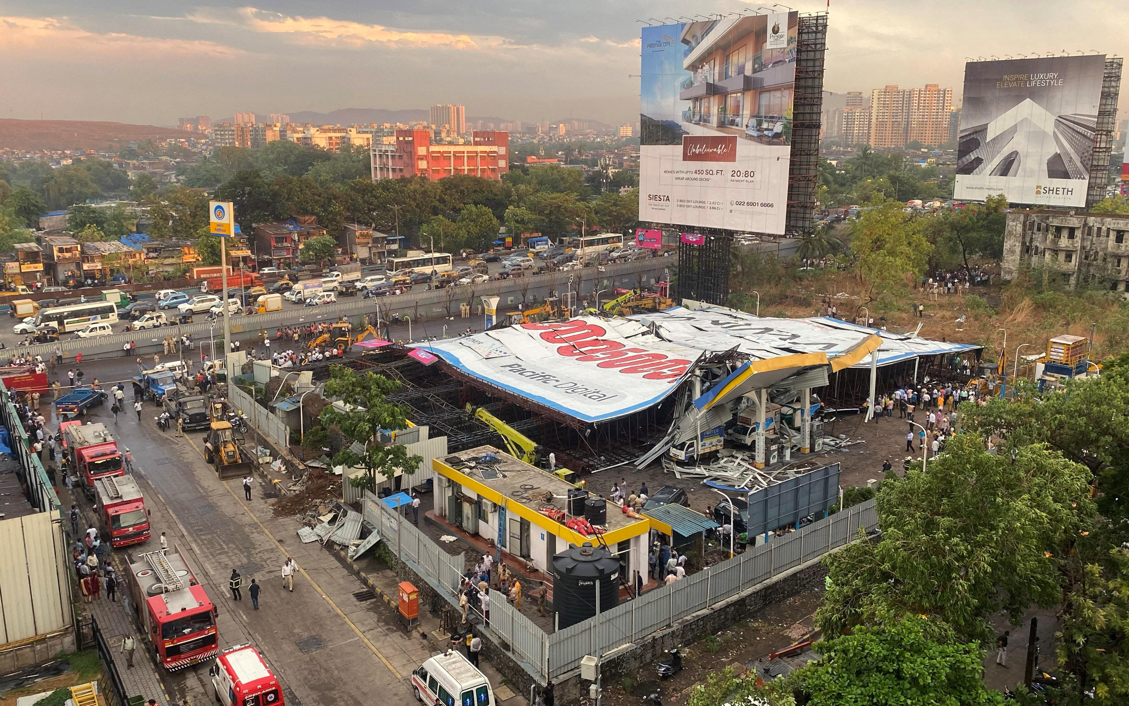 Huge billboard toppled by storm kills more than a dozen people in India