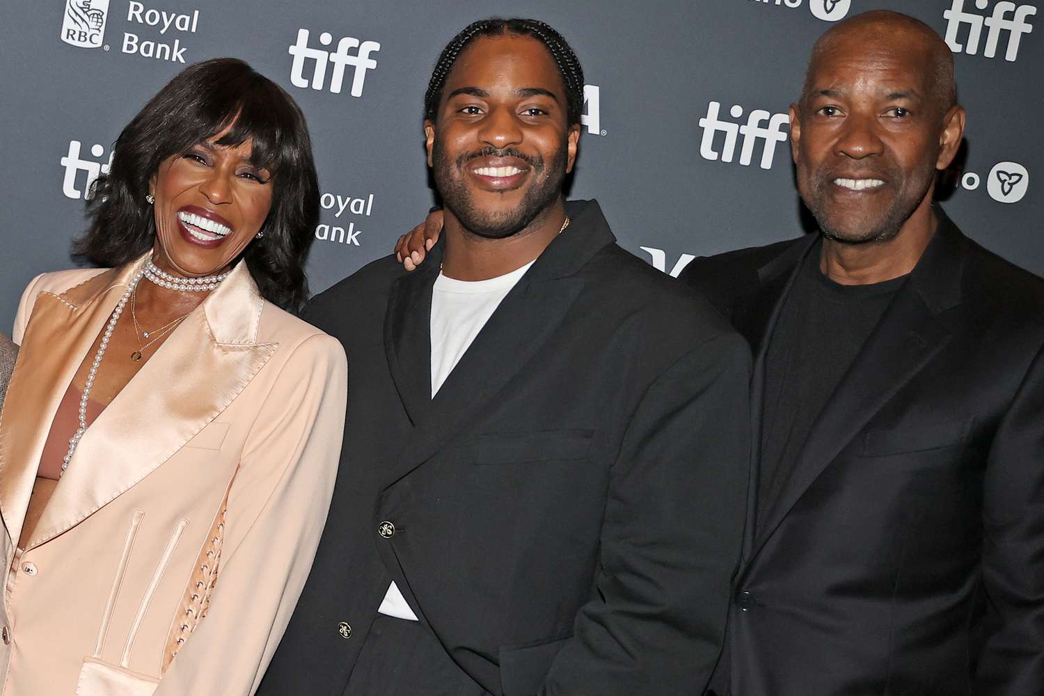 Denzel Washington's Son Malcolm Is 'Trying to Find' Secret to Parents' Long Marriage: 'They Love Each Other' (Exclusive)