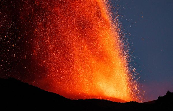 Mount Etna spews lava and ash into air as spectacular eruption unfolds