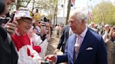 King Charles III surprises crowd outside Buckingham Palace