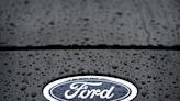Ford profits tumble on higher costs, hitting shares