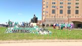 High schoolers create display of flags representing kids treated for a mental health crisis in 2023